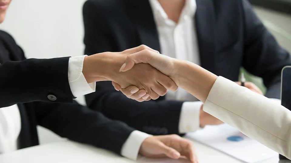 Business associates shaking hands